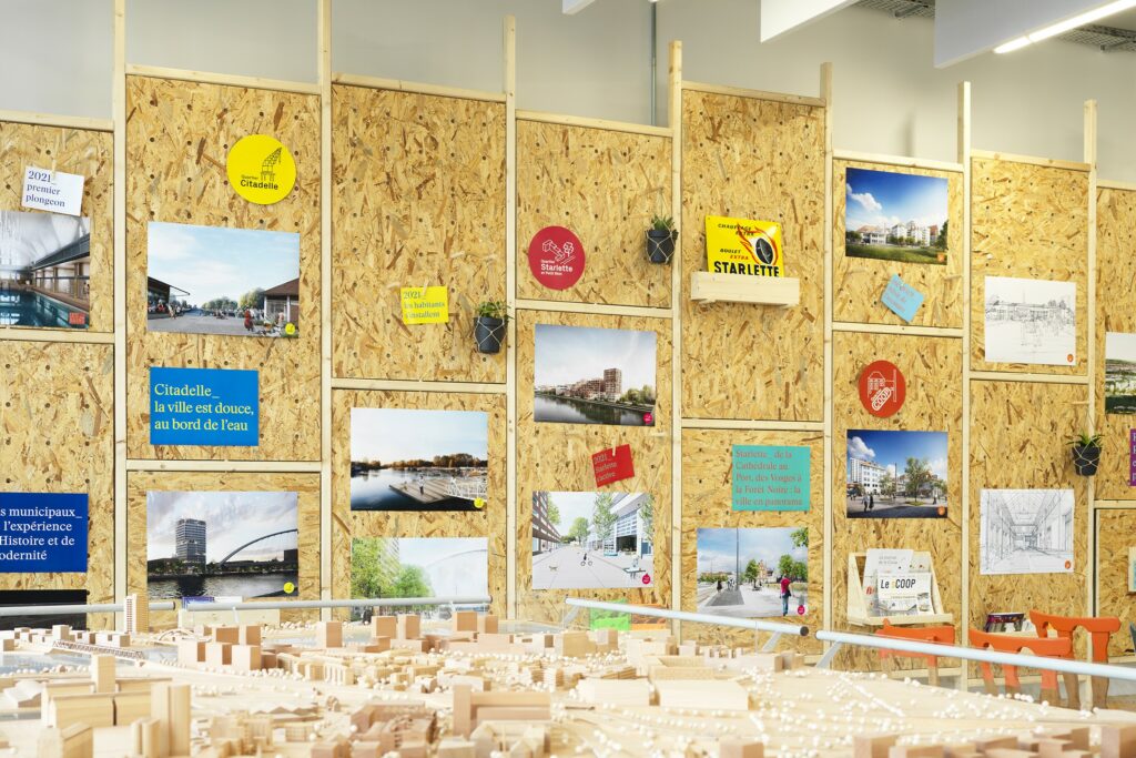 Display wall in the Point Coop, and model of the building. Photo credit: Siméon Levaillant